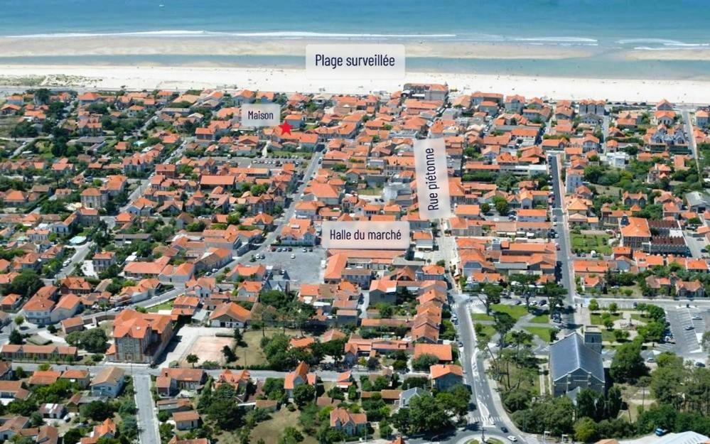 Vue aérienne annotée de Soulac-sur-Mer : la maison, la plage, la gare et la rue de la plage